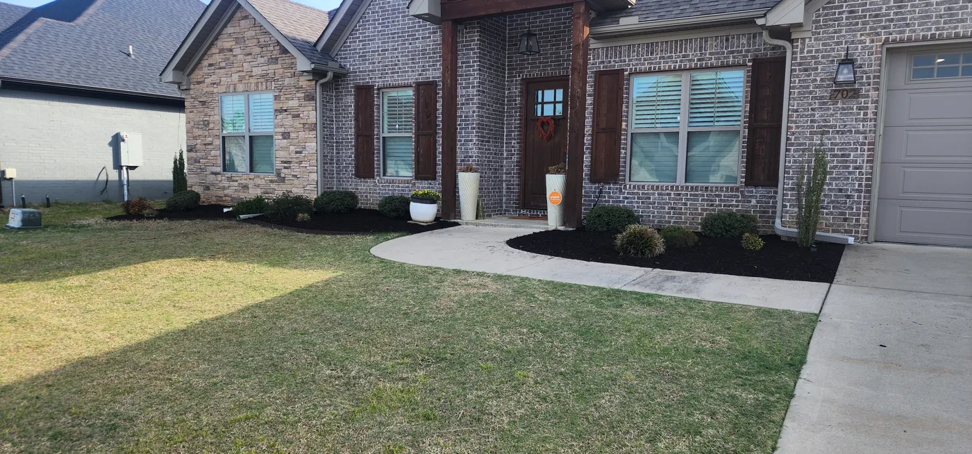 Freshly maintained lawn and landscape bed